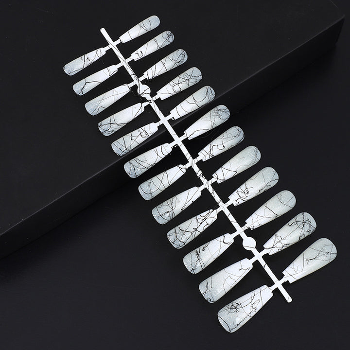 Artificial nails in modern ombre design with marbled accents Kalsten