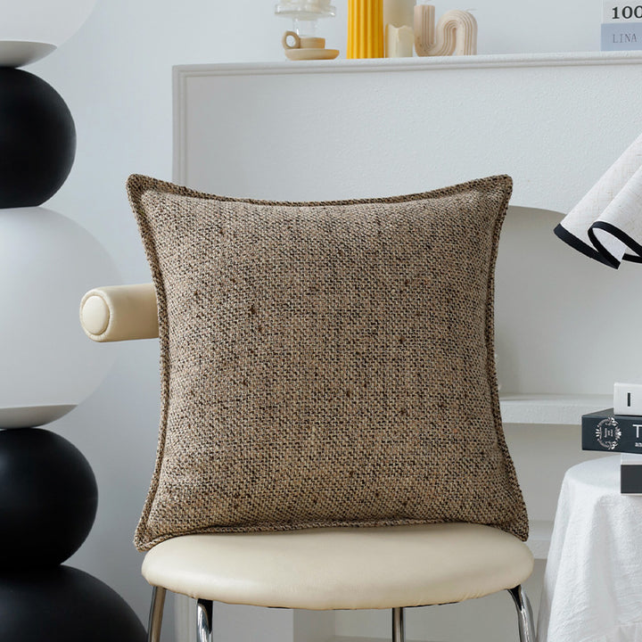 Square decorative cushion cover made of mottled bouclé weave with subtle piping Kalsten