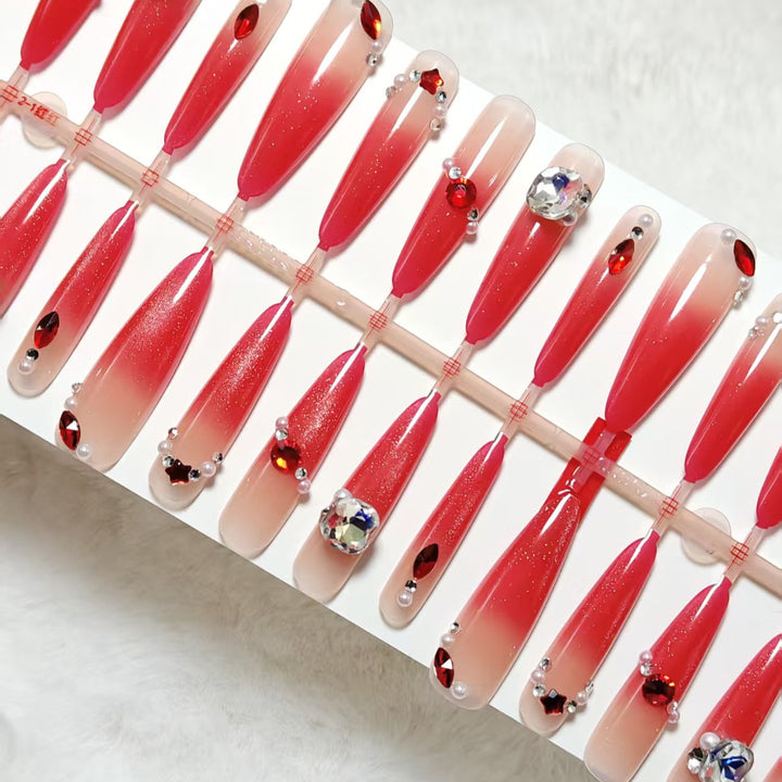 Glamorous artificial nails with sparkling ombre effect and elegant embellishments Kalsten