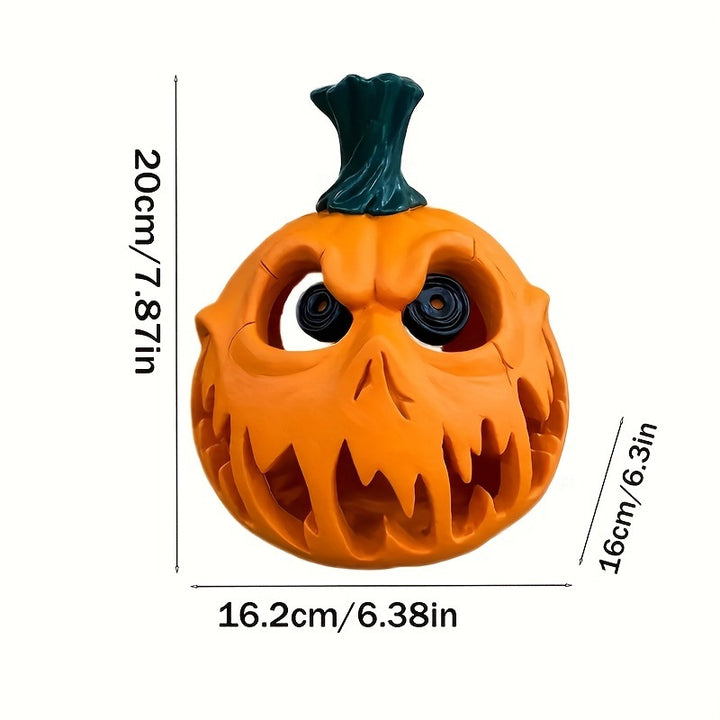 Ceramic pumpkin lantern with hollowed-out spooky face and tealight compartment