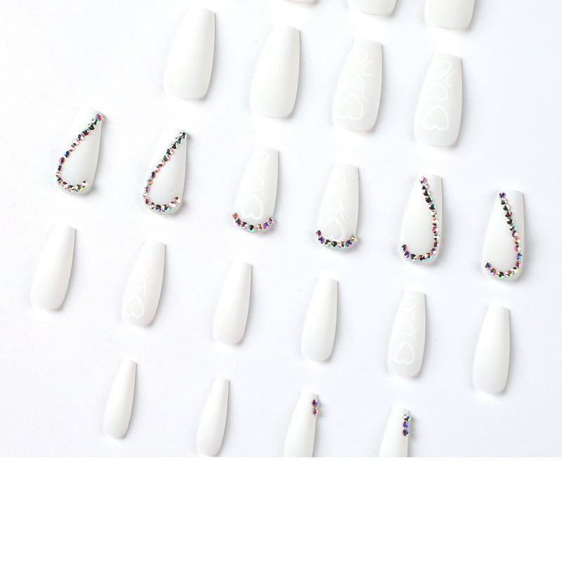 Artful Nail Extensions with Heart Design and Glitter Accents Kalsten
