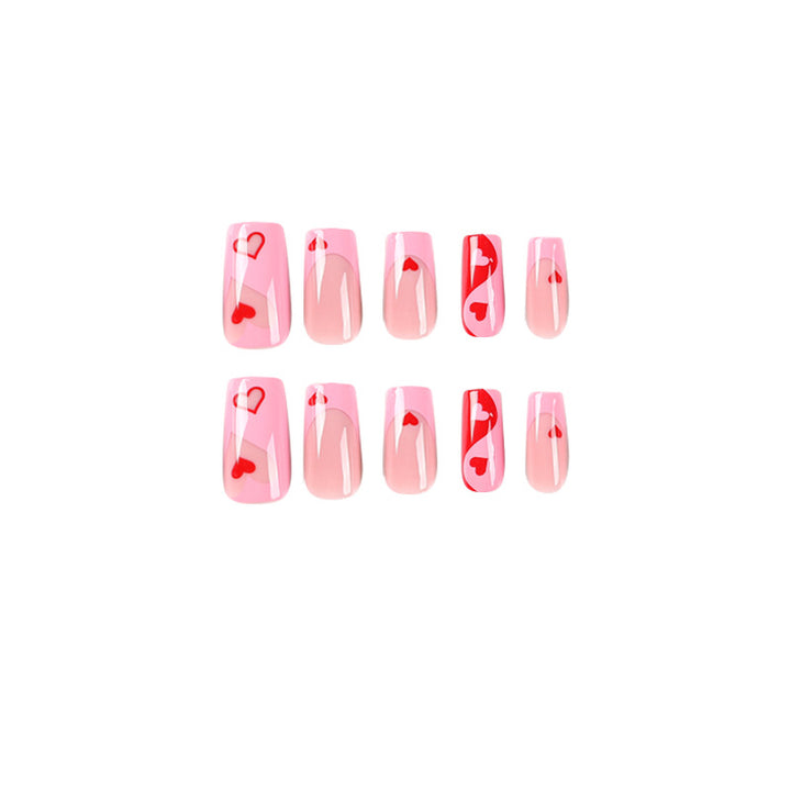 Artificial nail art with heart design and glitter accents Kalsten