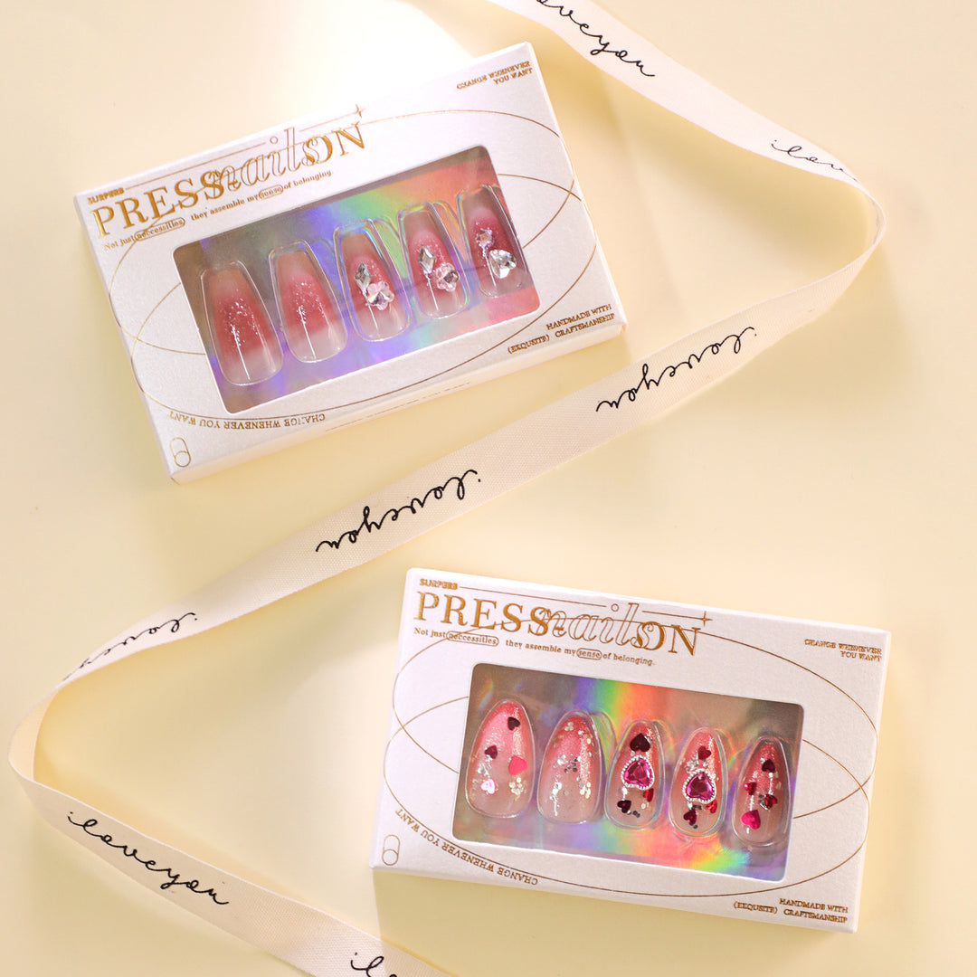 Artful nail art with playful heart designs and glitter Kalsten