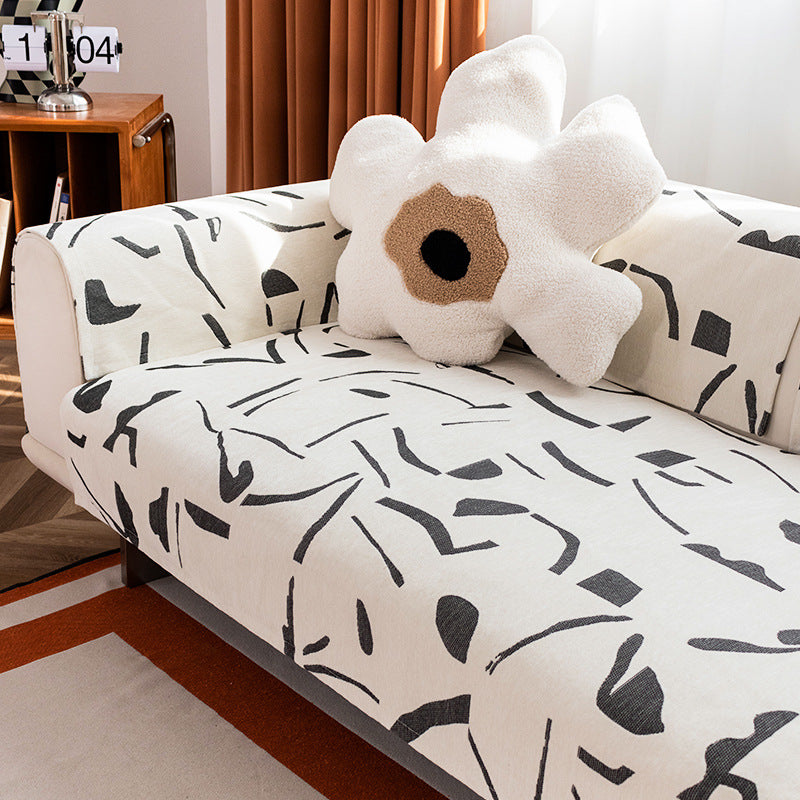 Stretch sofa cover with abstract brushstroke print and elastic waistband Kalsten