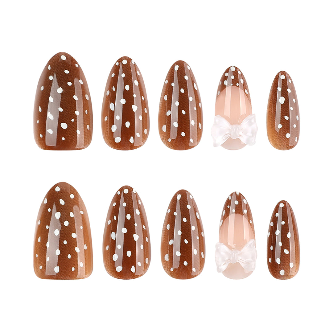 Artistic stiletto nails with delicate bow motif Kalsten