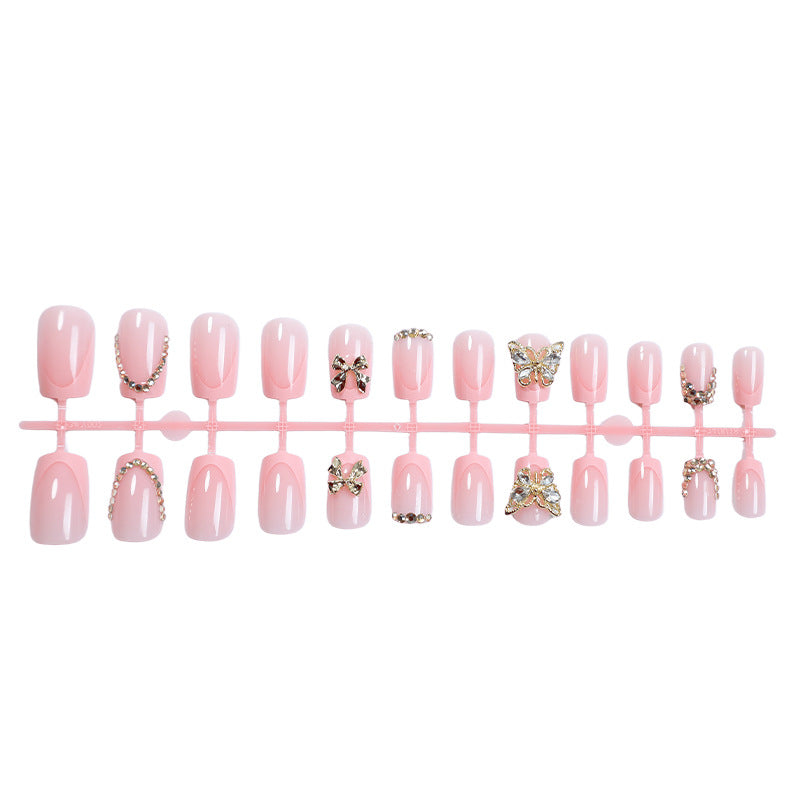 Glamorous artificial nail set with floral accents and glitter decorations Kalsten