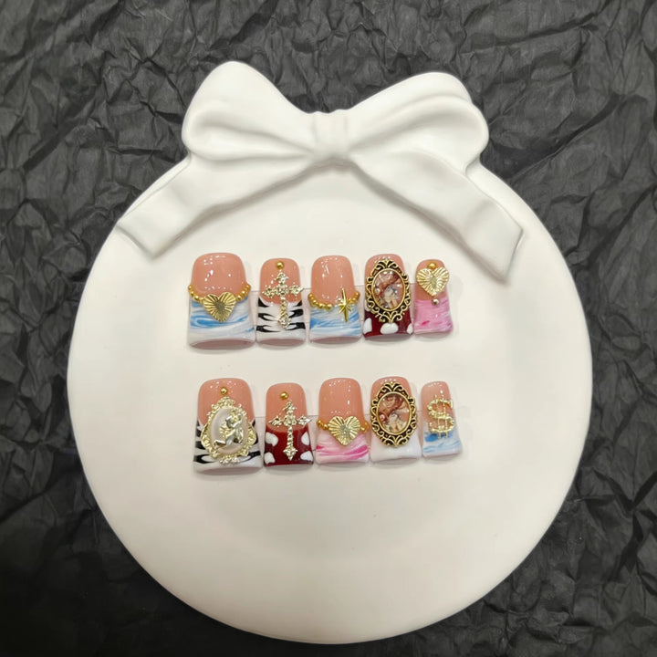 Artistic Press-On Nail Set with Gold Accents and Unique Designs
