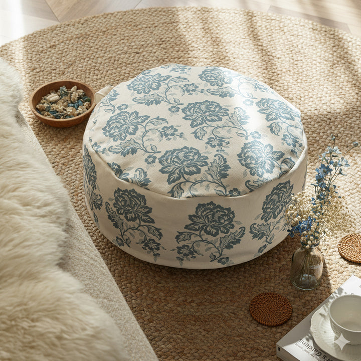 Round seat pouf with floral jacquard weave, stable upholstery core, and carrying handle Kalsten