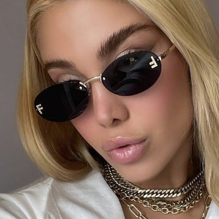 Women's fashionable sunglasses with elegant, round lenses and delicate metal frame Kalsten