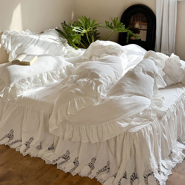 Romantic bedding set with voluminous ruffle, lace bed skirt, and double-layered frills