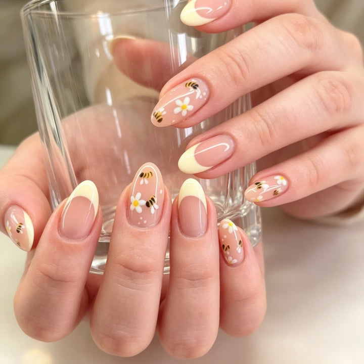 Artificial nails with elegant French tip and floral accents Kalsten