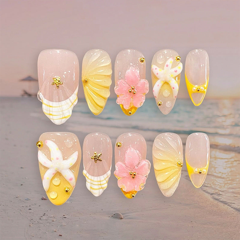 Artificial nail set with glamorous floral designs and creative glitter accents Kalsten