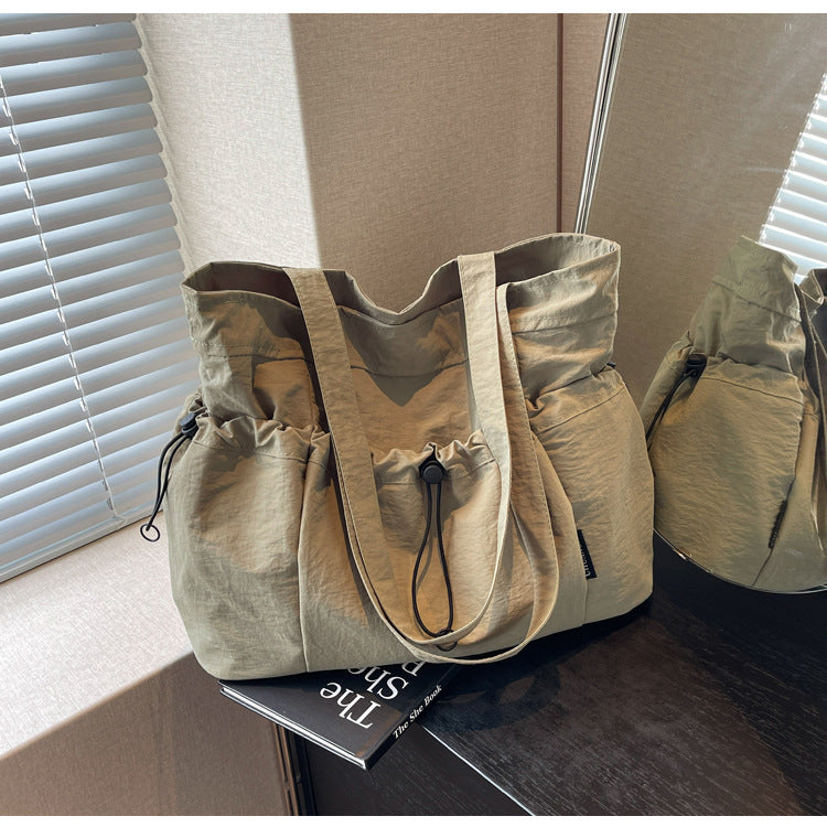 Practical everyday handbag with drawstring Kalsten