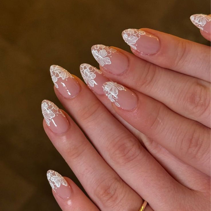 Artistic stiletto nails with floral embellishments Kalsten