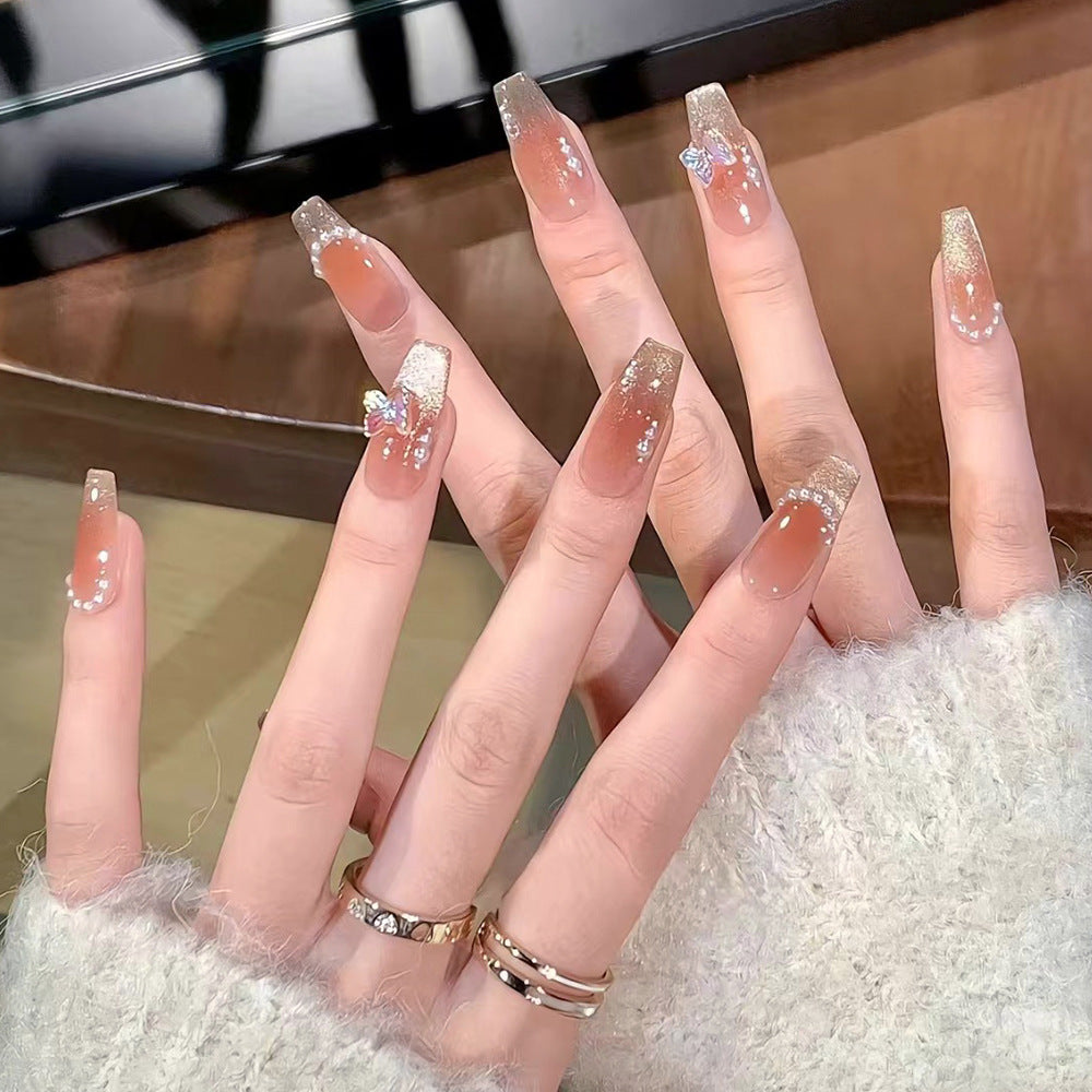 Glamorous artificial nails with elegant bow and butterfly design Kalsten