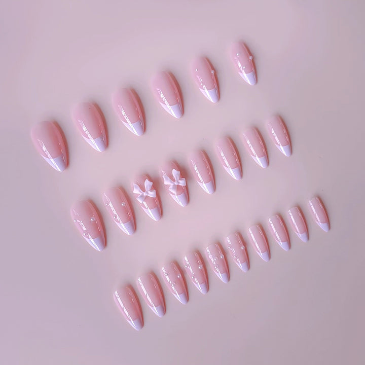 Artificial nail set with shimmering 3D bows and elegant pearl accents Kalsten