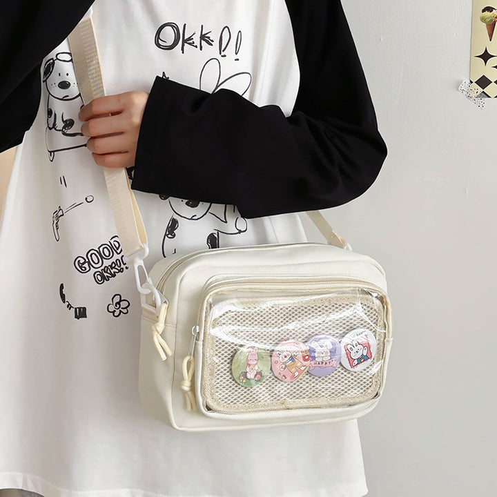 Shoulder bag with transparent viewing pocket and playful graphic design Kalsten