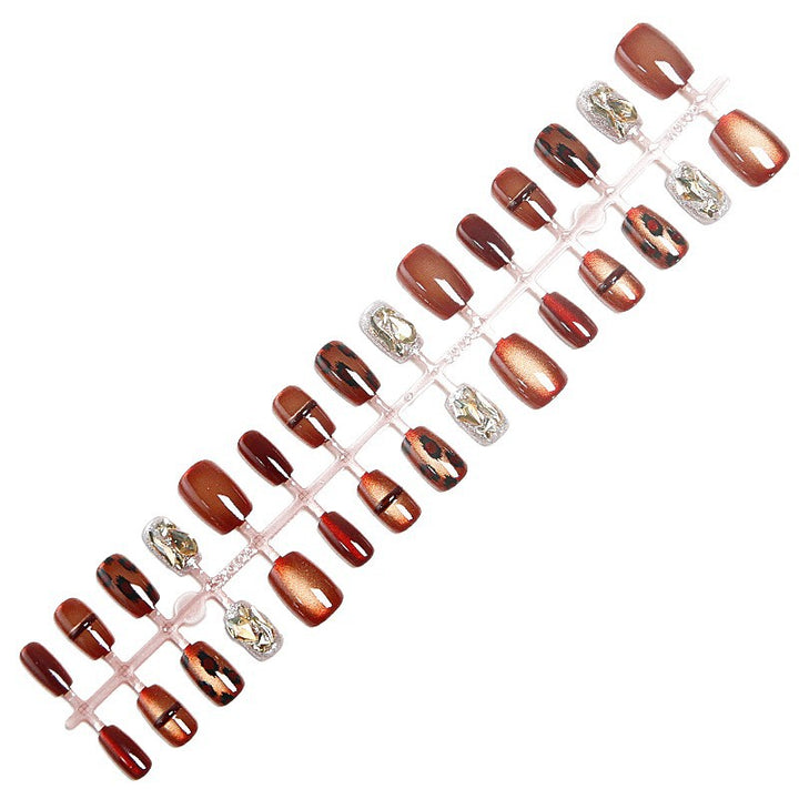 Glamorous artificial nails with animal design and glitter accents Kalsten