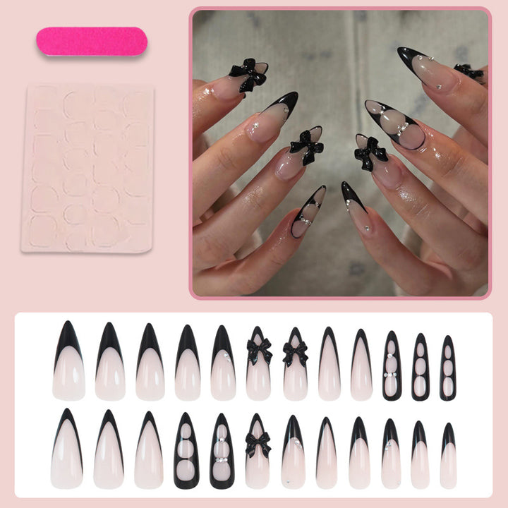 Acrylic nail set with shimmering accents and elegant bows Kalsten