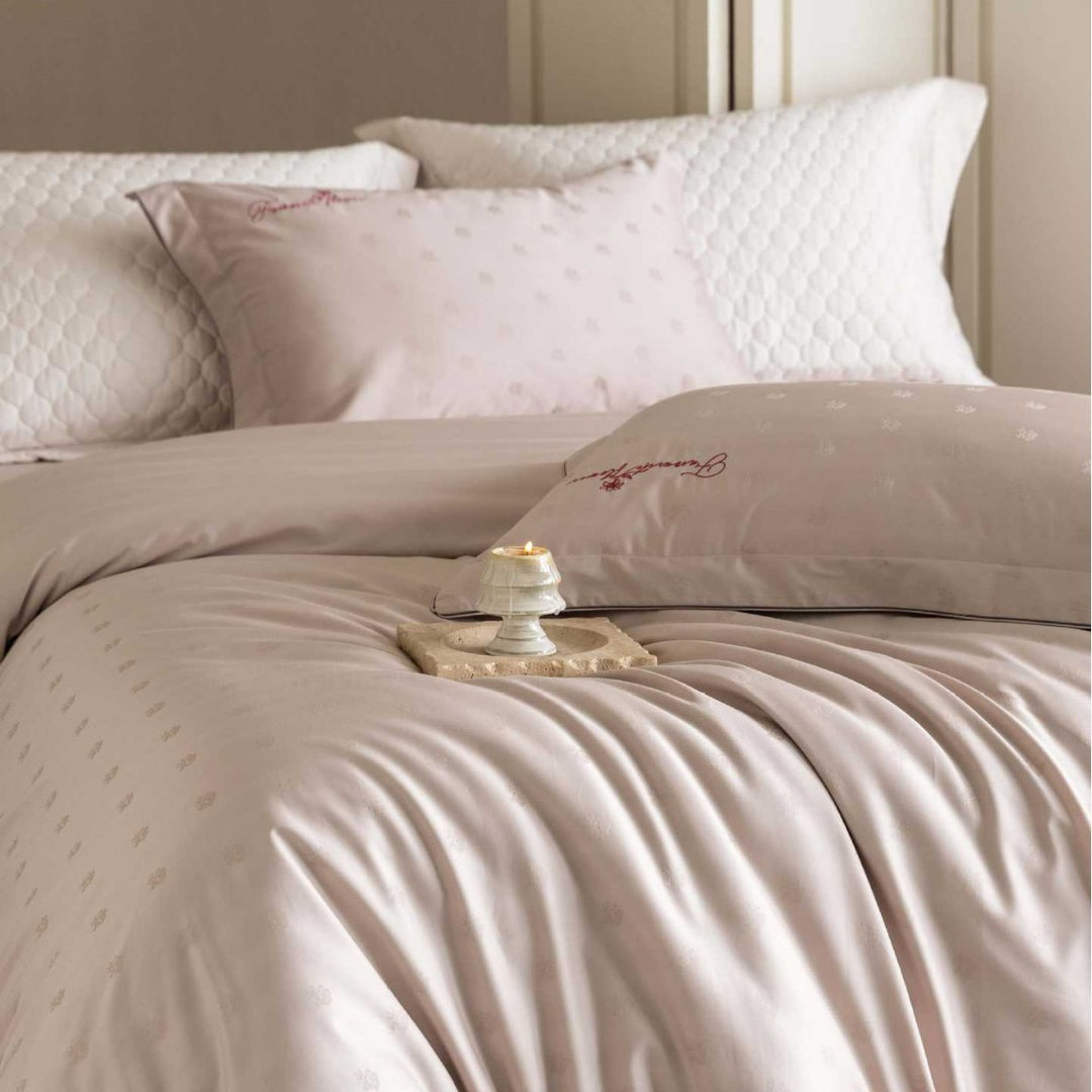 Luxurious satin bedding complete set with quilted cover and delicate logo embroidery