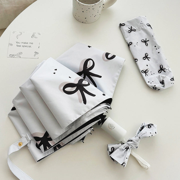 Women’s Folding Umbrella with Playful Bow Pattern Kalsten