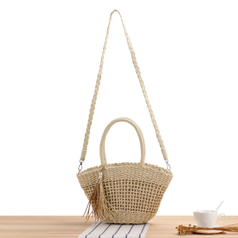 Handbag made of braided natural material with elegant tassel decoration Kalsten