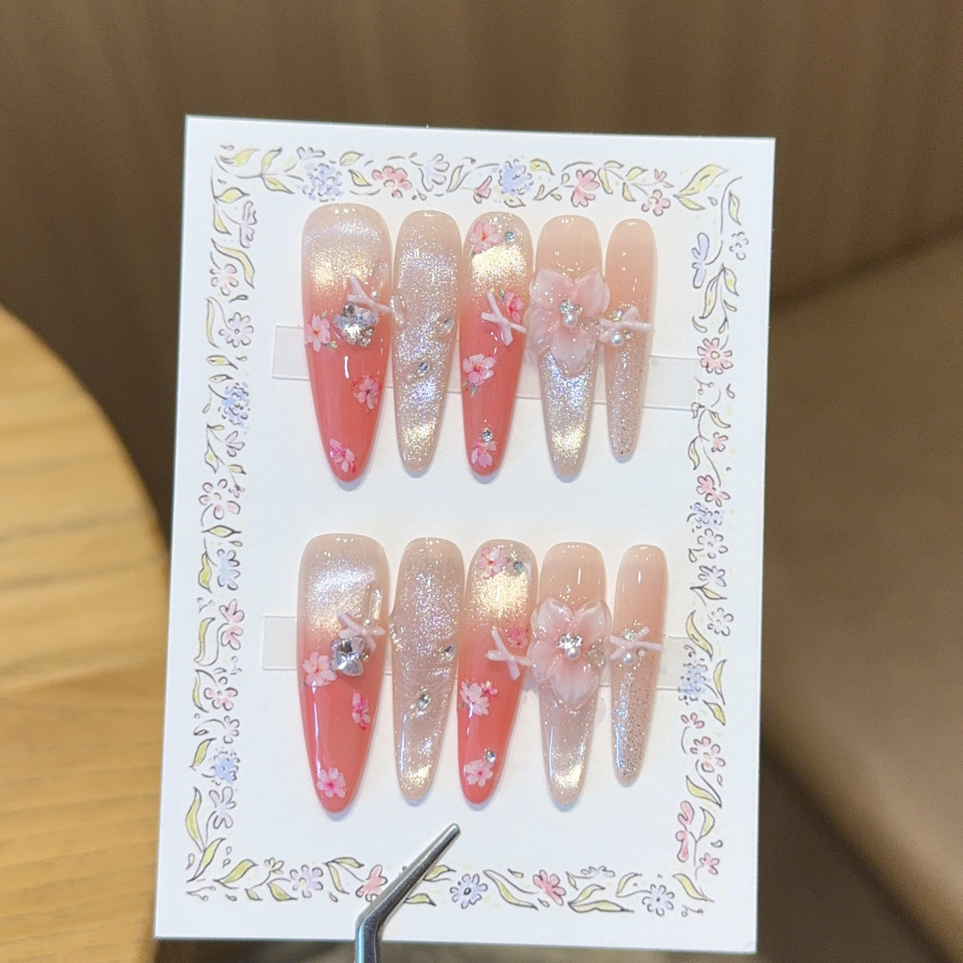 Artificial nails with floral embellishments and glitter effects Kalsten