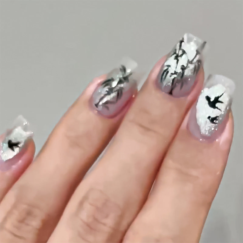 Handcrafted acrylic nails with decorative bird motifs Kalsten