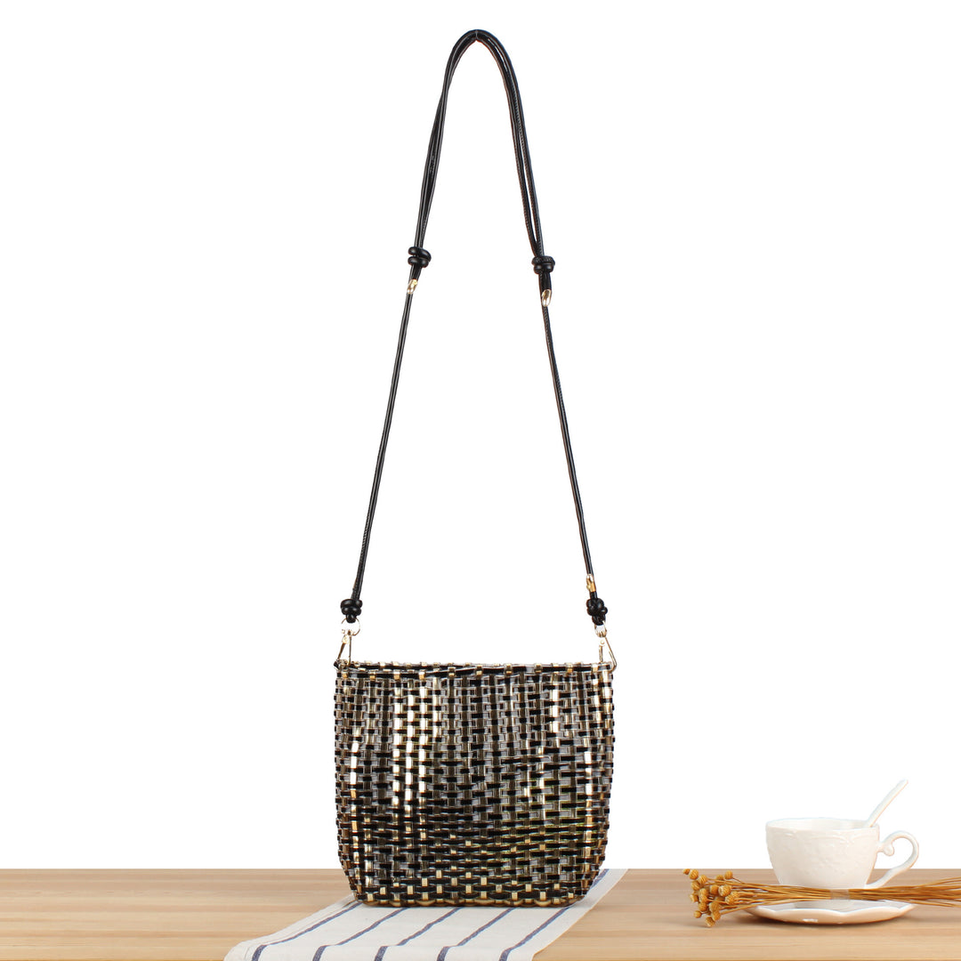 Shoulder bag made of handwoven synthetic material with fashionable sliding mechanism Kalsten