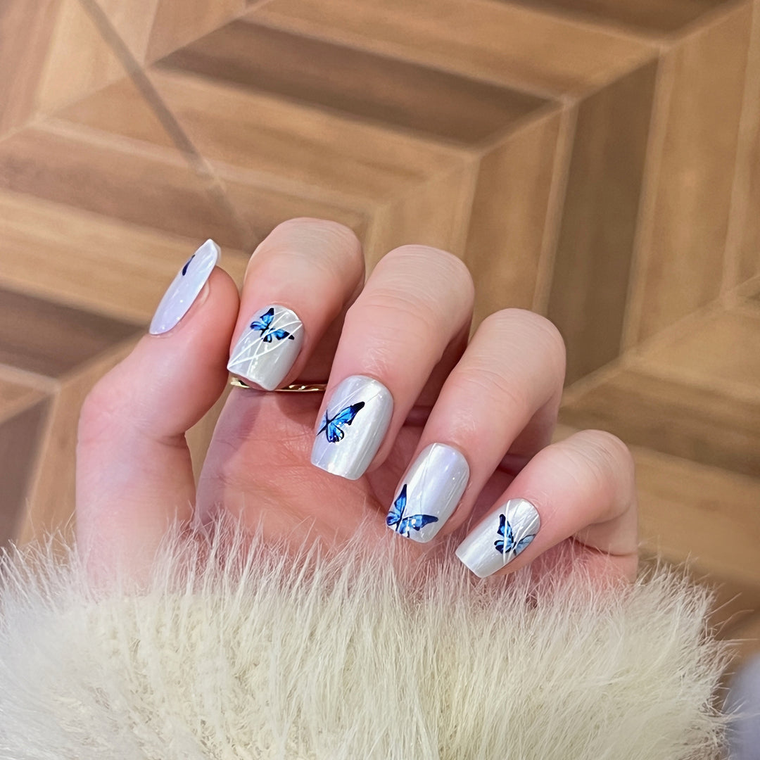 Creative nail extensions with intricate butterfly design Kalsten