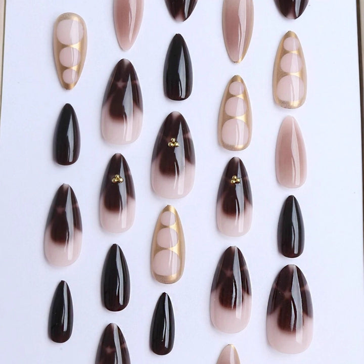 Artificial nail set with elegant ombre design and gold embellishments Kalsten