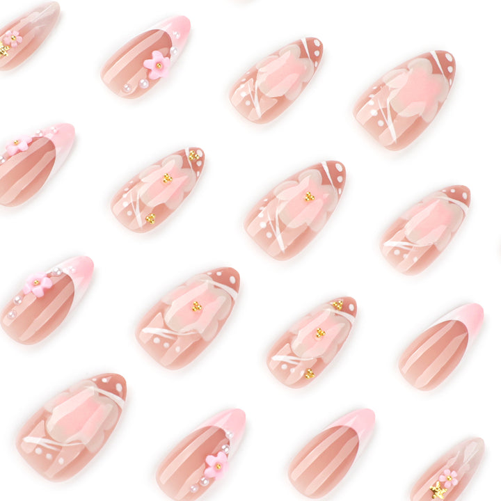 Artful nail extensions with floral patterns and glitter accents Kalsten