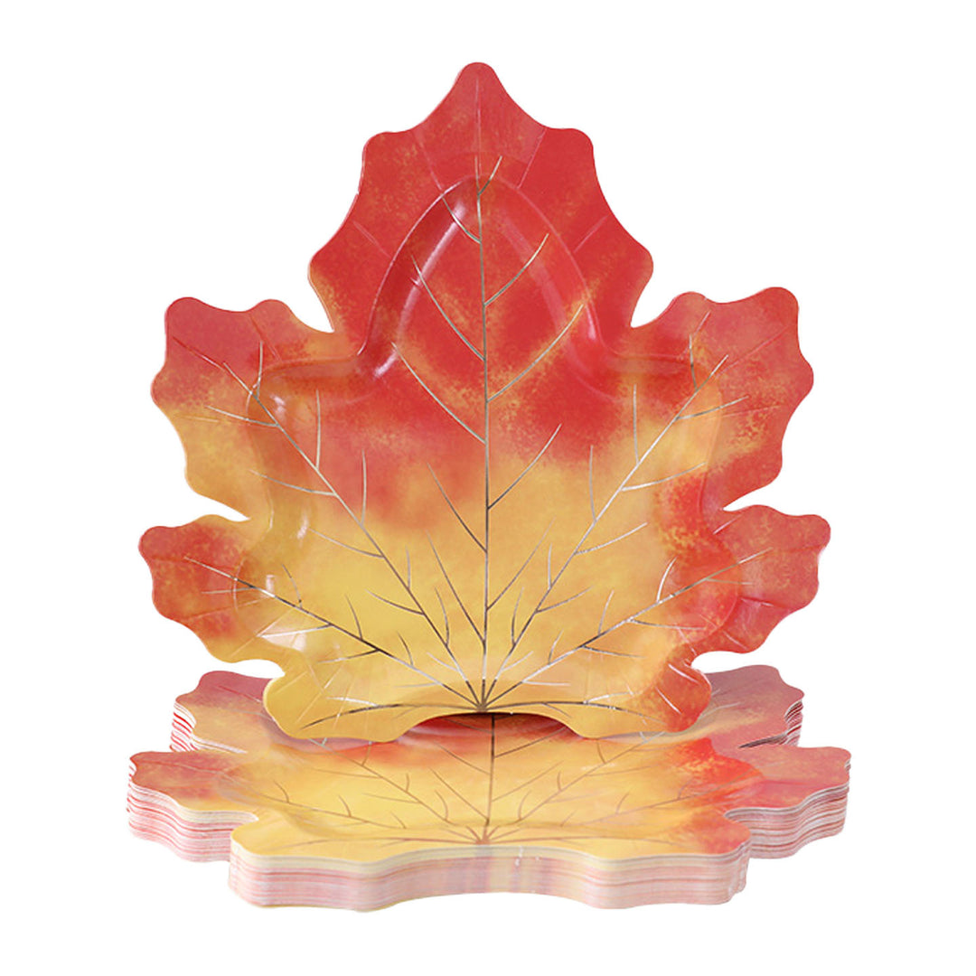 Disposable paper plates in pumpkin shape with spooky face design
