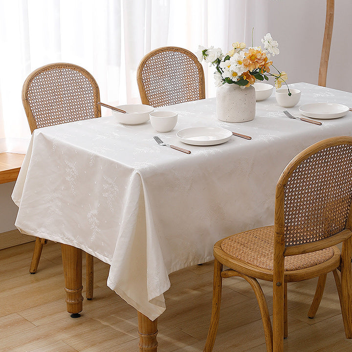 Rectangular premium table linen made of jacquard polyester with subtle frost floral embossing Kalsten