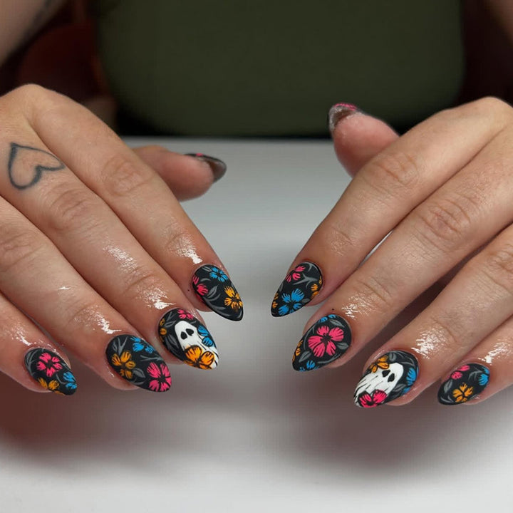 Artificial nail set with spooky Halloween design and colorful floral accents Kalsten