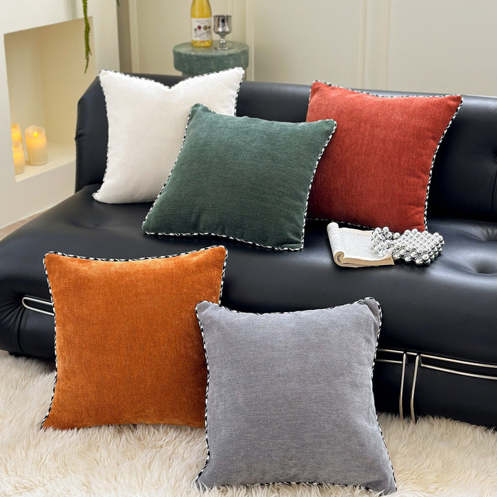 Decorative square decorative pillow made of soft velvet with contrasting piping