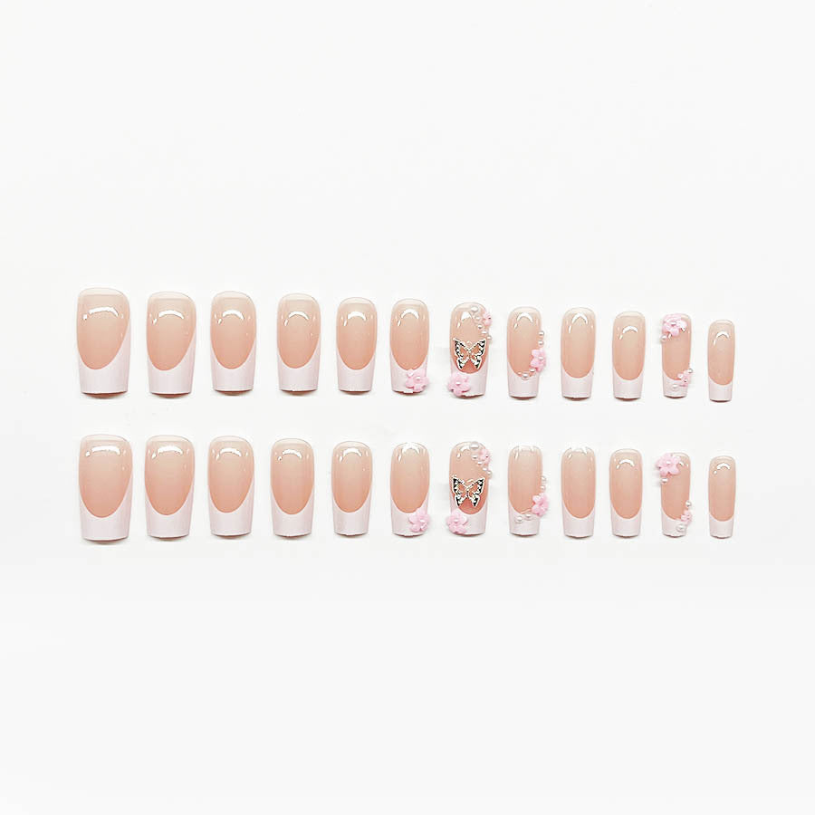 Artificial nail set with playful 3D flowers and glitter accents Kalsten