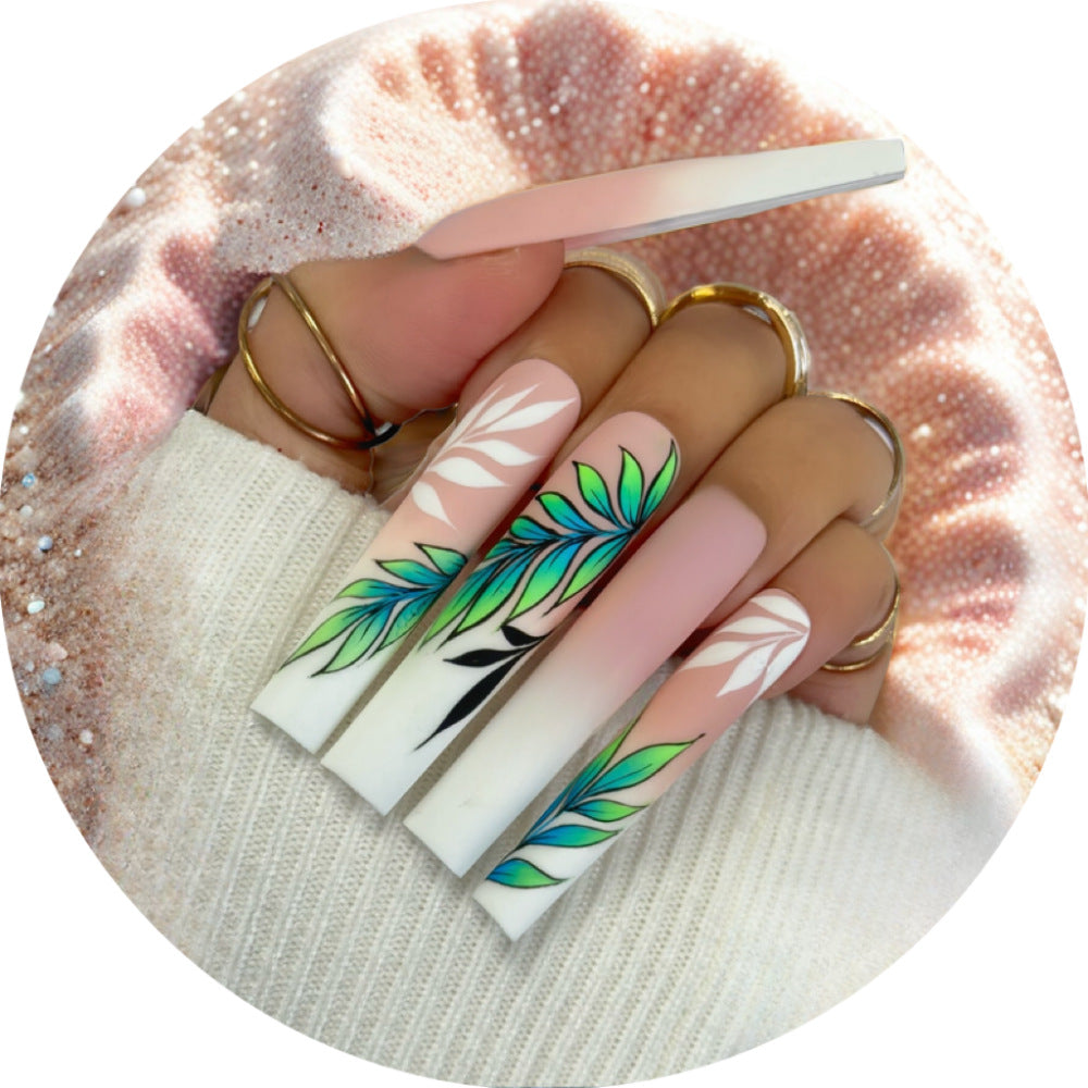 Artificial nails with elegant ombre design and floral accents Kalsten