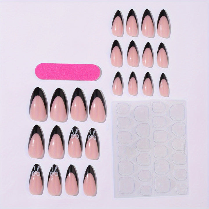 Acrylic nail set with elegant black and white design and cute bow accents Kalsten