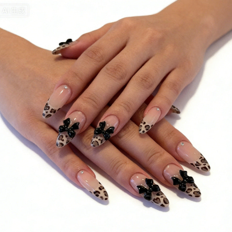 Creative artificial nails with stylish leopard pattern and bow accents Kalsten