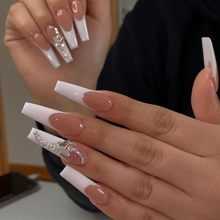 Acrylic nail set with glamorous tips embellishments and elegant accents Kalsten