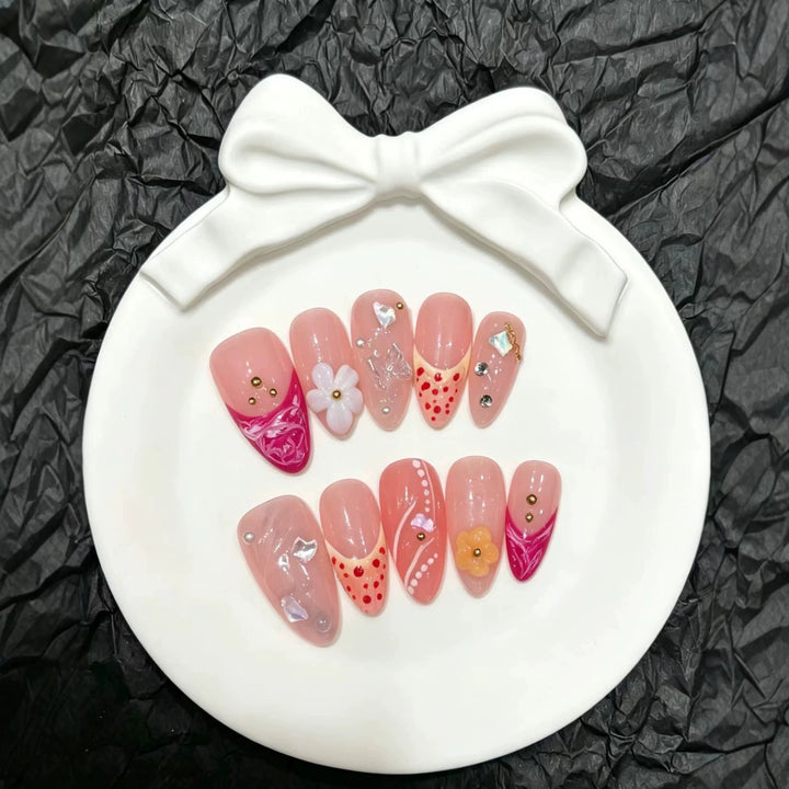 Artistic Press-On Nail Set with Floral and Decorative Elements