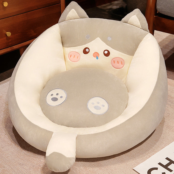 Plush pet bed with raised edge and removable cuddly pillow