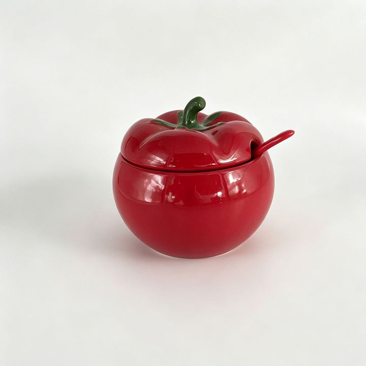 Ceramic storage jar in pumpkin shape with lid and spoon