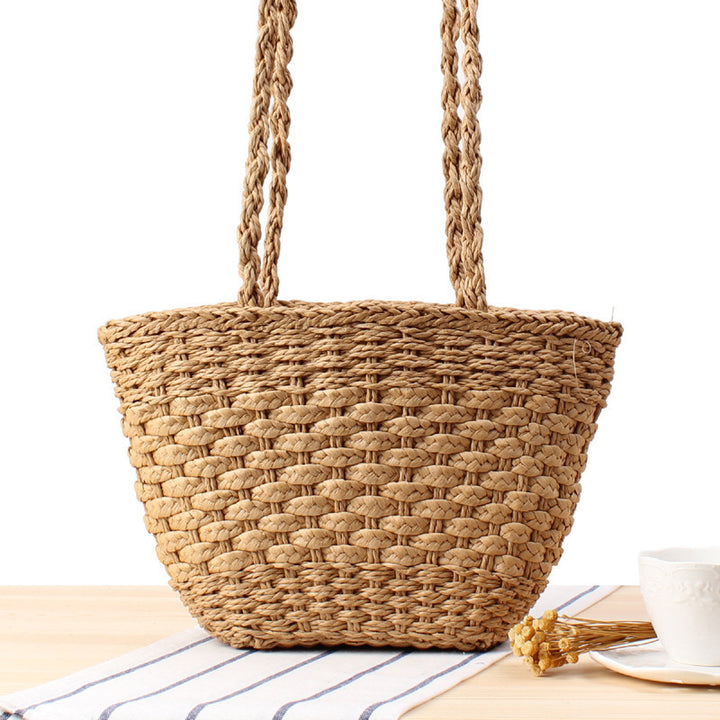 Braided handbag made of natural raffia with robust carrying straps Kalsten
