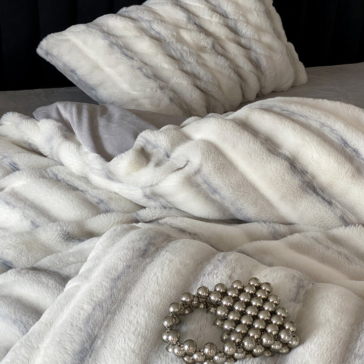 Luxury faux fur throw and cushion set with striped texture