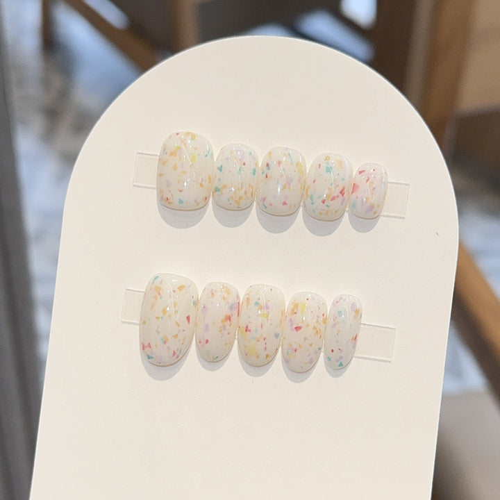 Artificial nails with cheerful sparkle design Kalsten