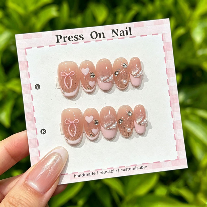 Artistic Press-On Nail Art Set with Cute Character and Bow Accents