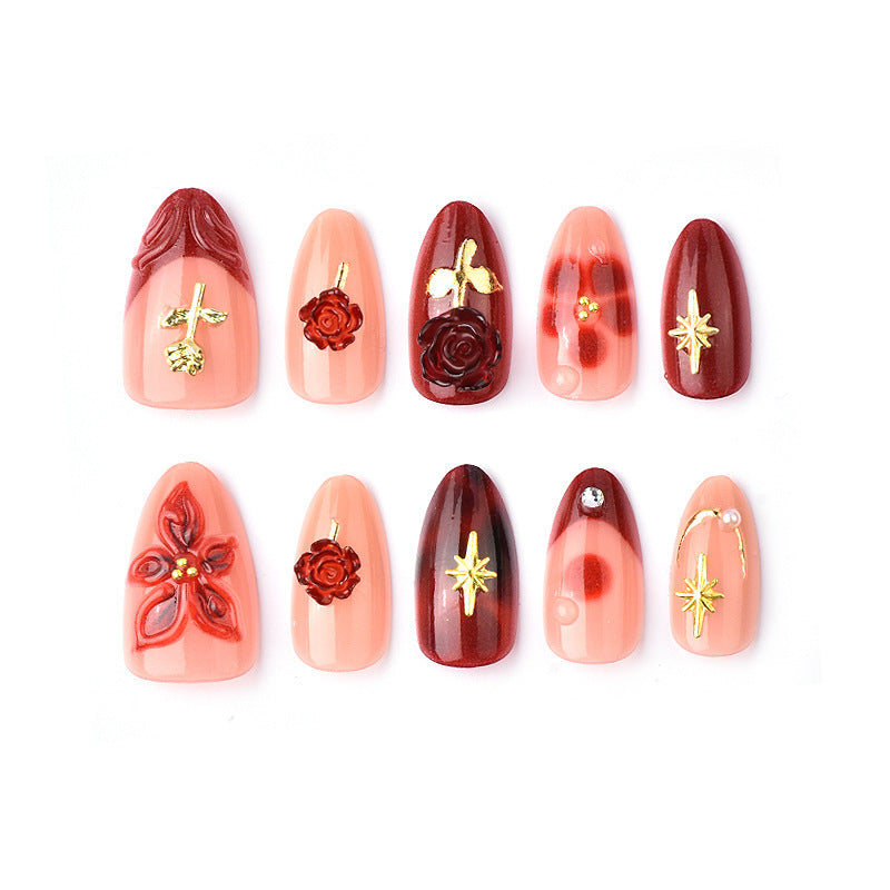 Artificial nail set with elegant floral applications and glamorous accents Kalsten