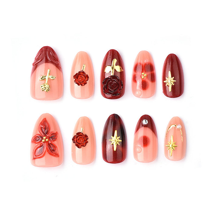 Artificial nail set with elegant floral applications and glamorous accents Kalsten